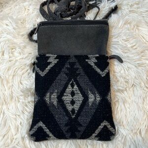 Manitobah Mukluks suede crossbody bag.